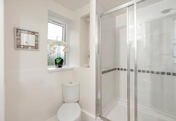 The family bathroom has a large walk-in rainfall shower.