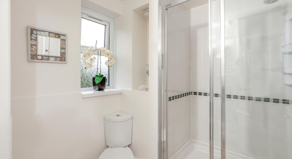 The family bathroom has a large walk-in rainfall shower.