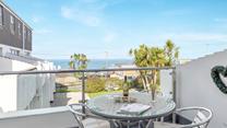 Enjoy beautiful sea views from the private balcony.