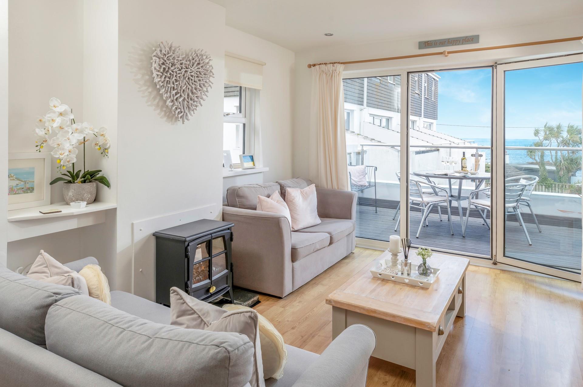 Admire the views from the balcony and the comfortable living area.