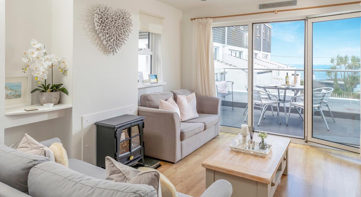 Admire the views from the balcony and the comfortable living area.