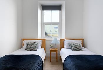 The twin bedroom has views across St Ives Bay.