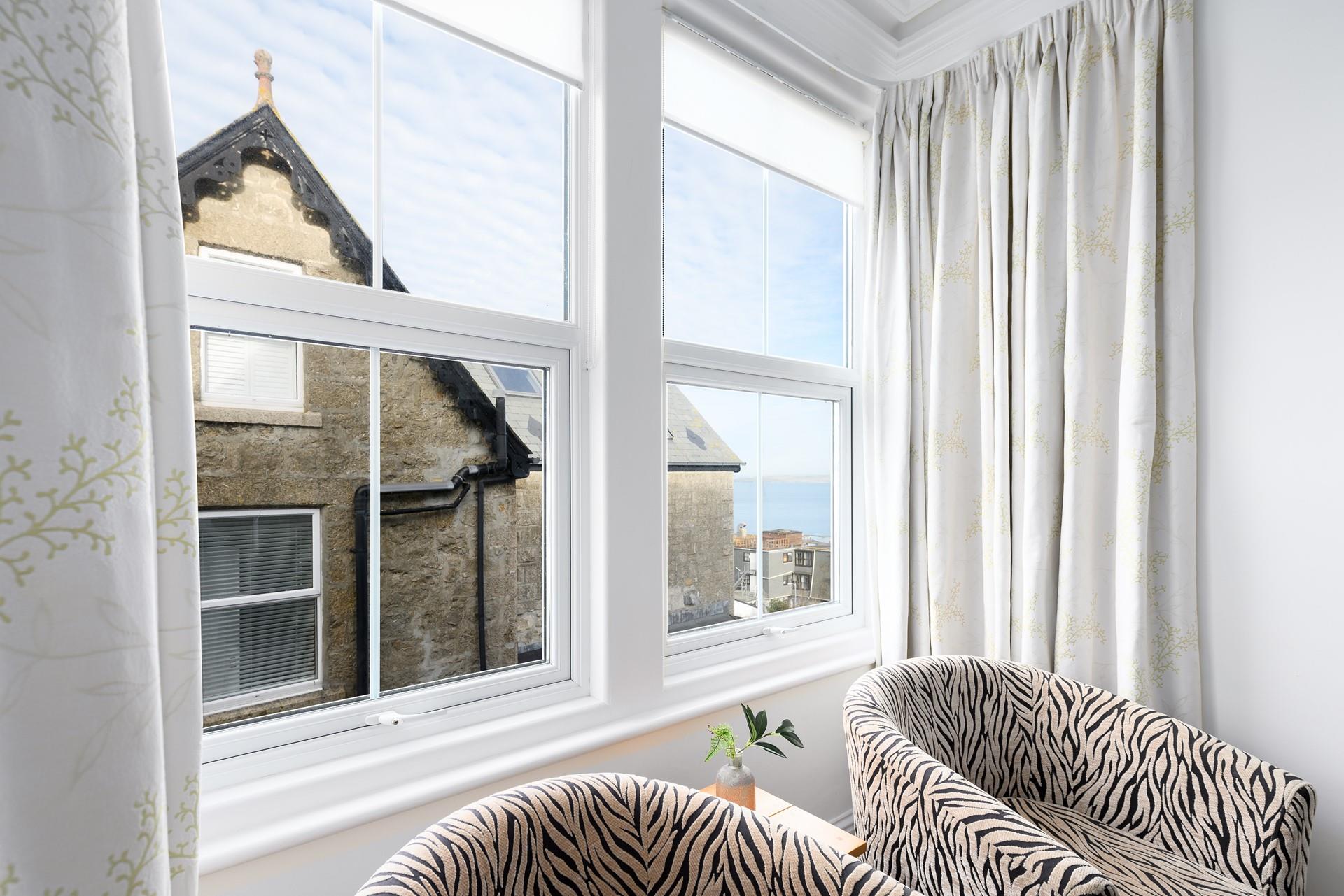 Sit in the window and get stuck into a good book with a sea view backdrop.