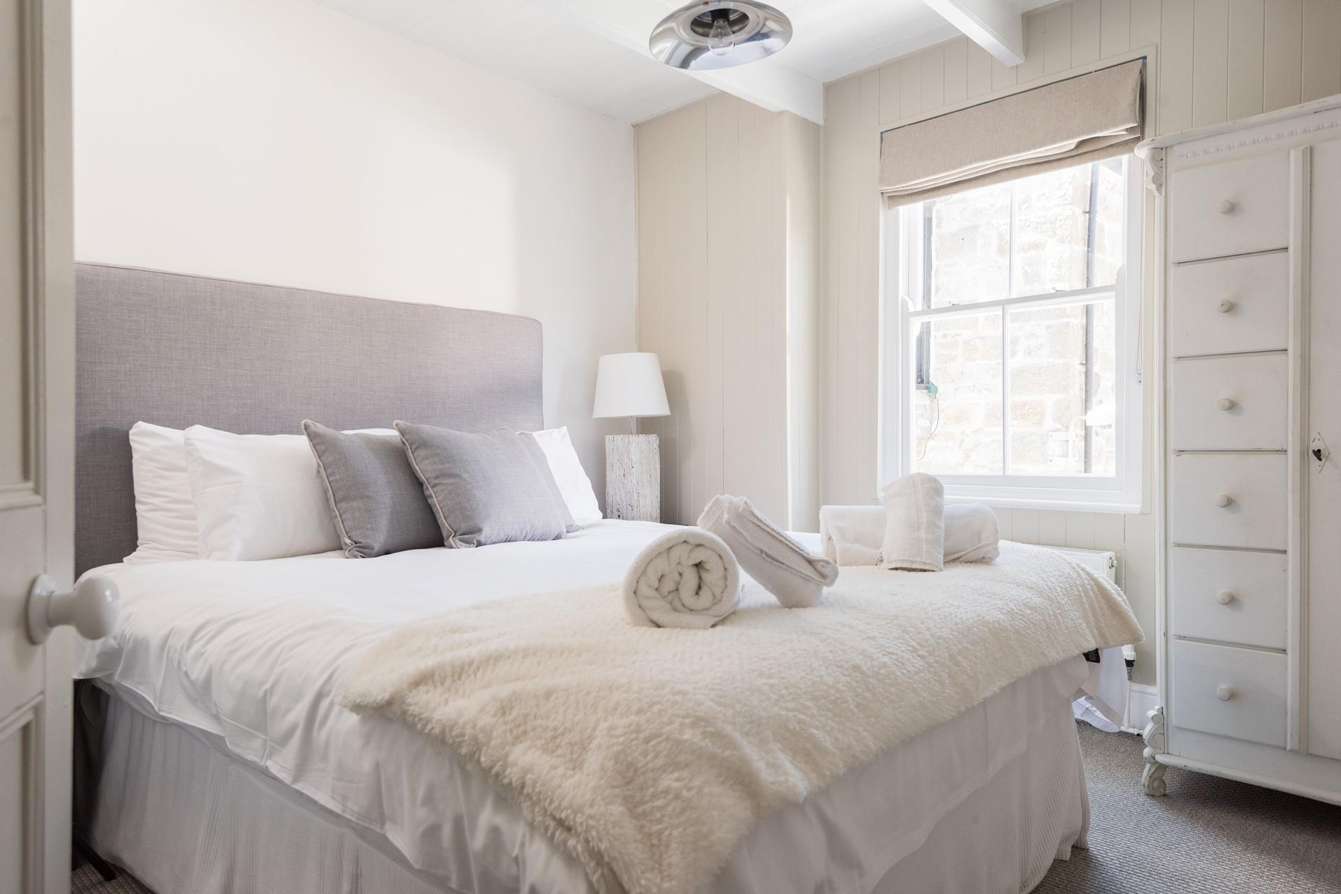 Bedroom 1 has a sumptuous king size bed for a dreamy night's sleep.