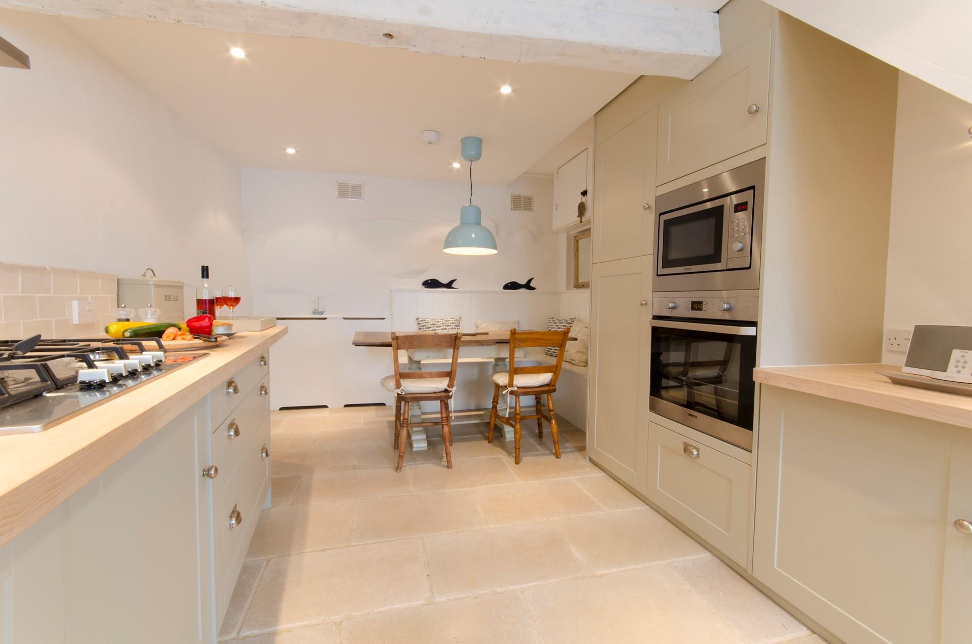 The kitchen is modern and well-equipped perfect for cooking up a storm.