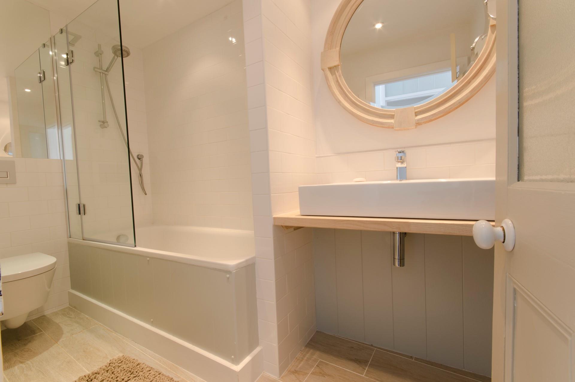 Wash off sandy toes in the shower after a day on the beach.