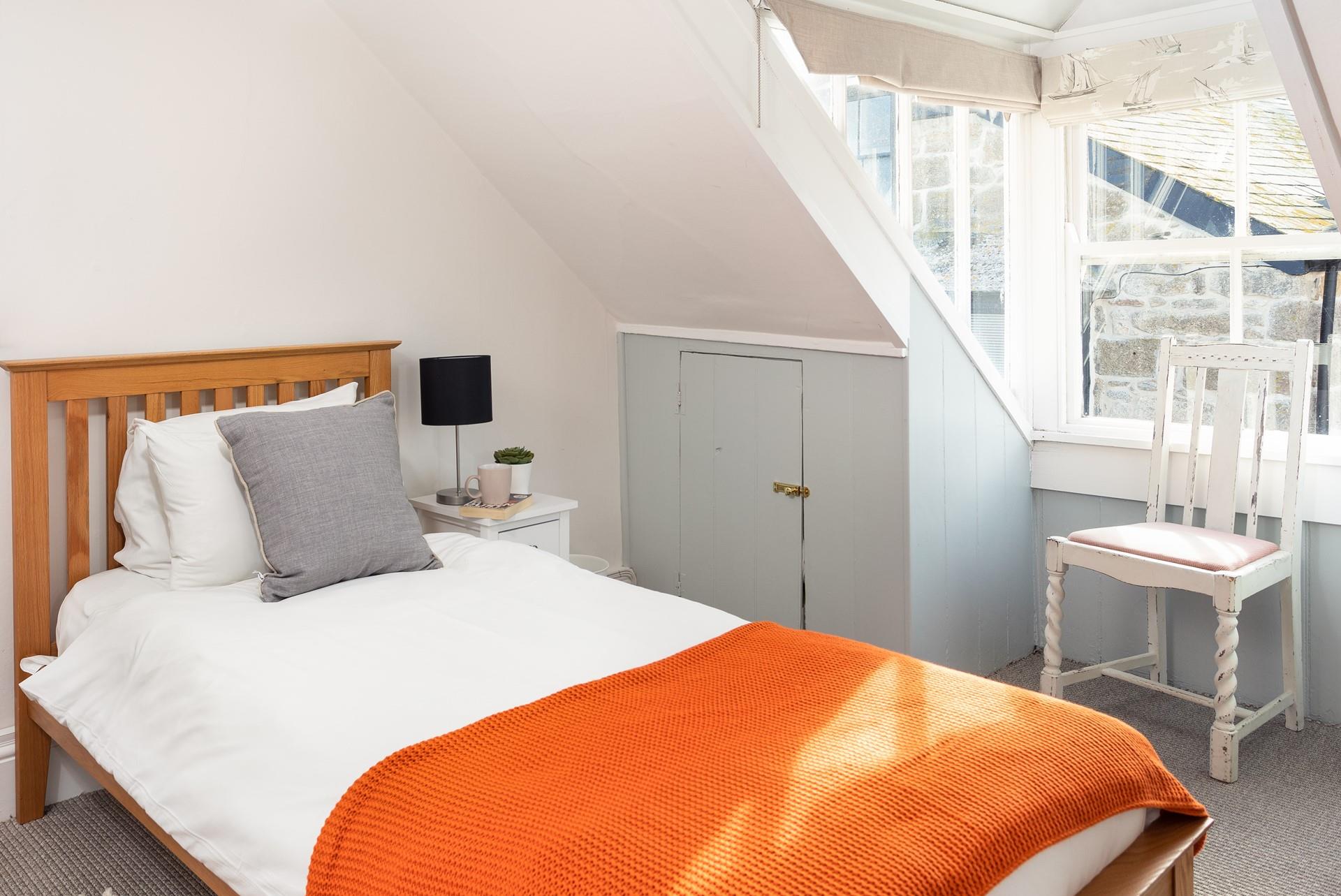 Bedroom 2 has twin beds, perfect for young adults or children.