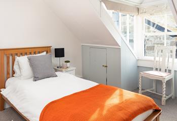 Bedroom 2 has twin beds, perfect for young adults or children.