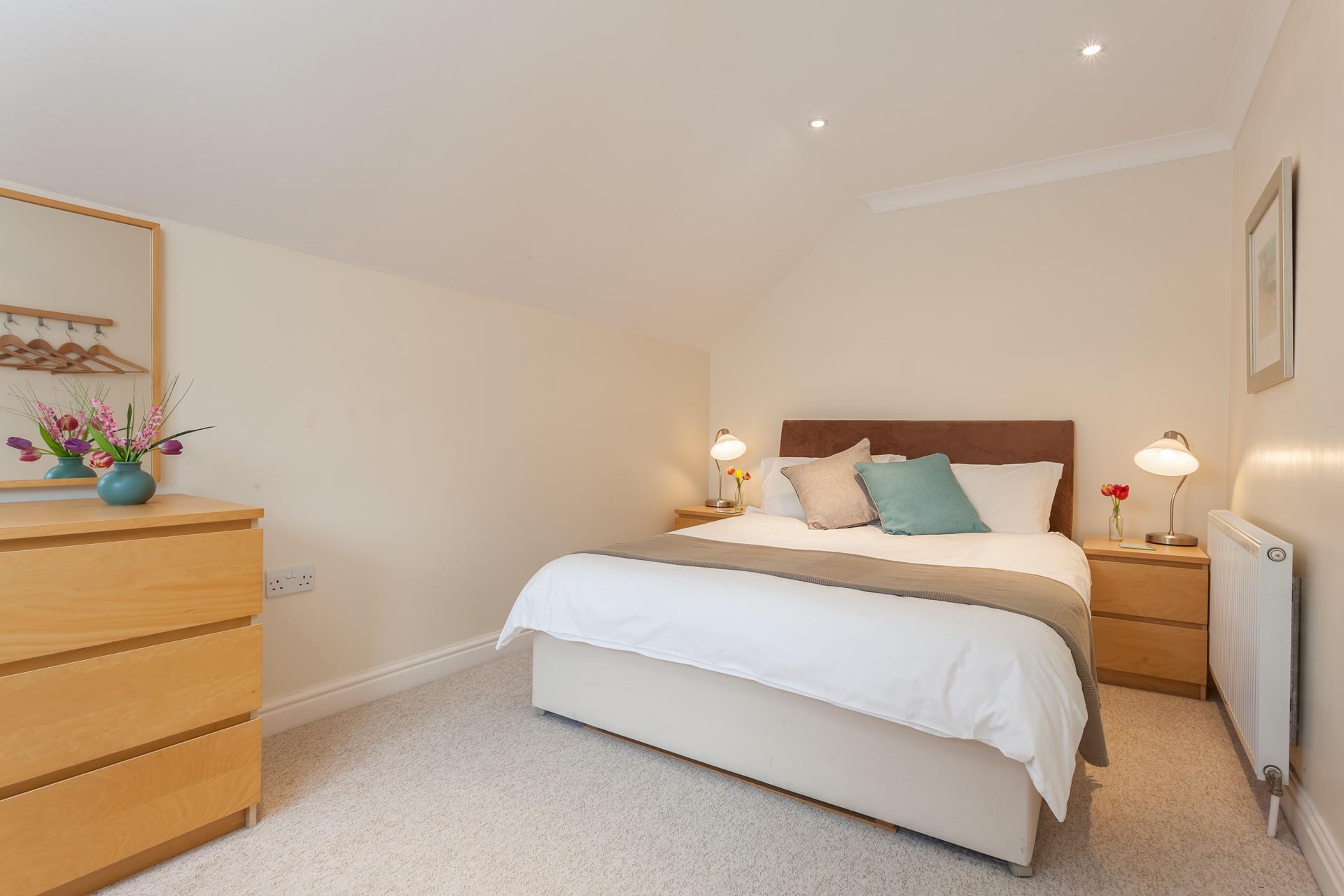 The bedroom is wonderfully spacious with a large bed that will ensure a fantastic night's sleep.