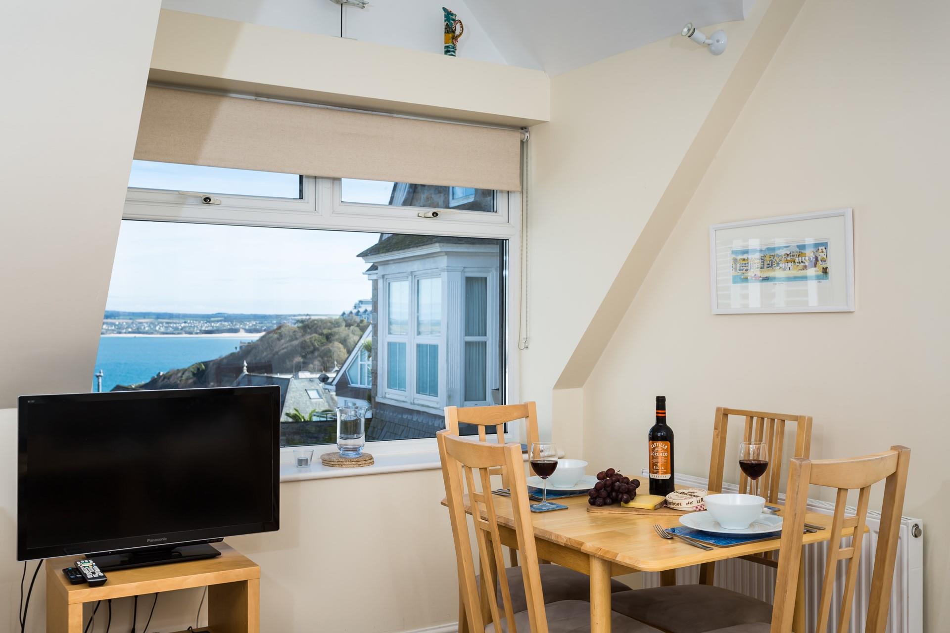 The table conveniently folds out to offer more room, folding away after meals to save space.