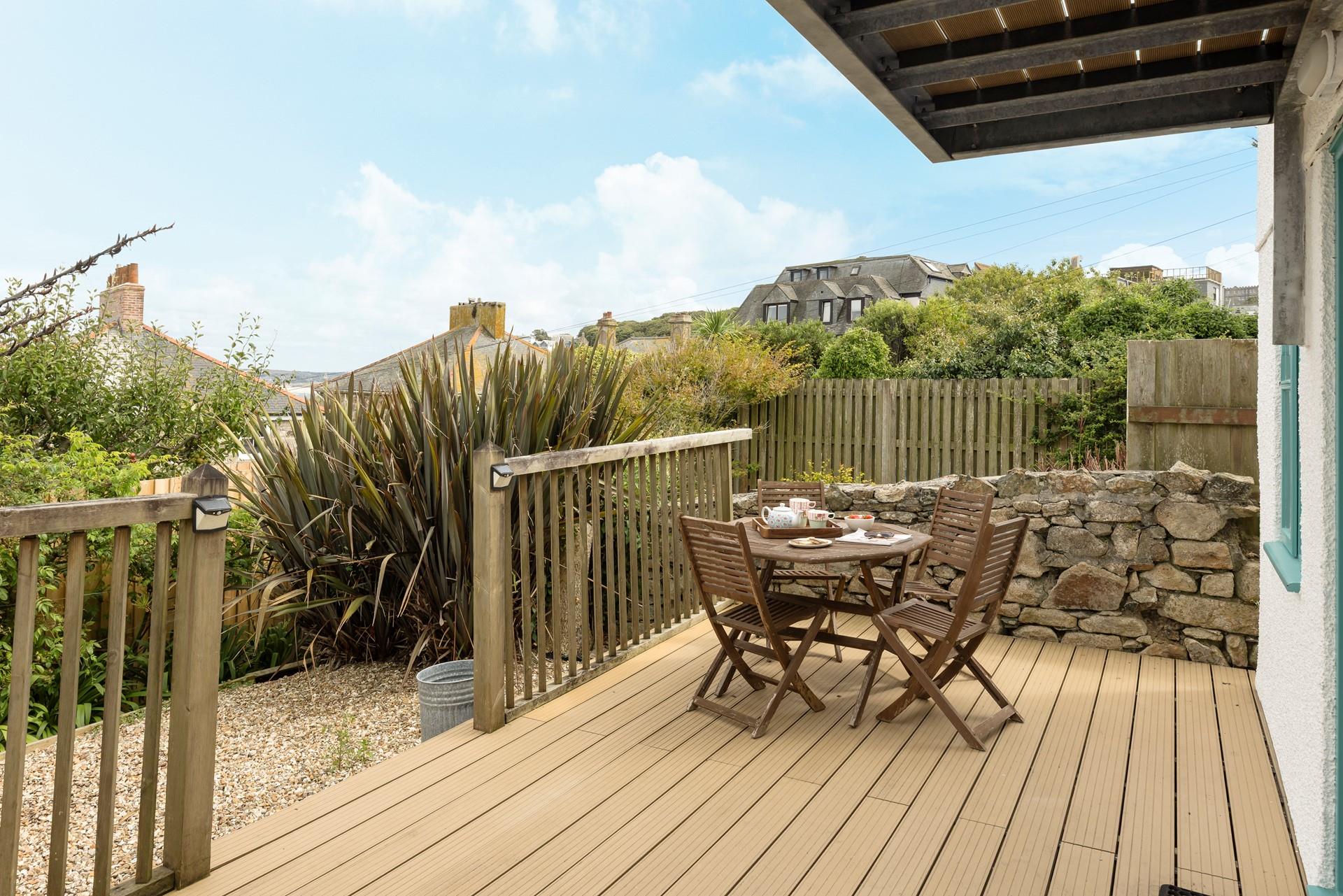 Tuck into a Cornish cream tea in the afternoon sunshine.