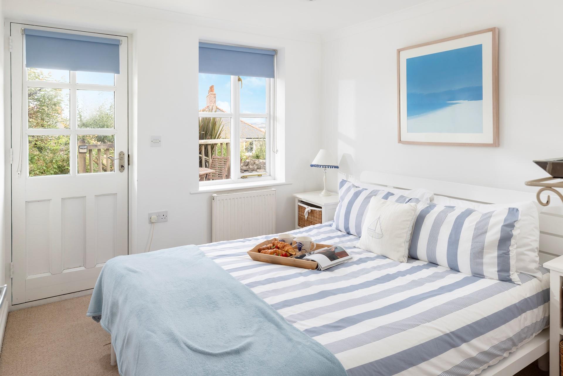 The double bedroom has access to the decking area.