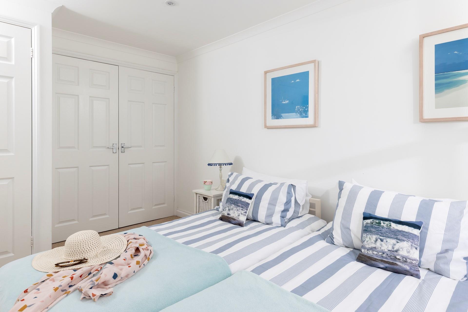 The bedrooms are decorated with sea blues.