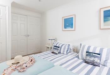 The bedrooms are decorated with sea blues.