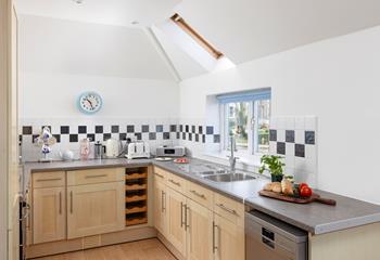 The modern kitchen is well-equipped to prepare tasty meals for the family.