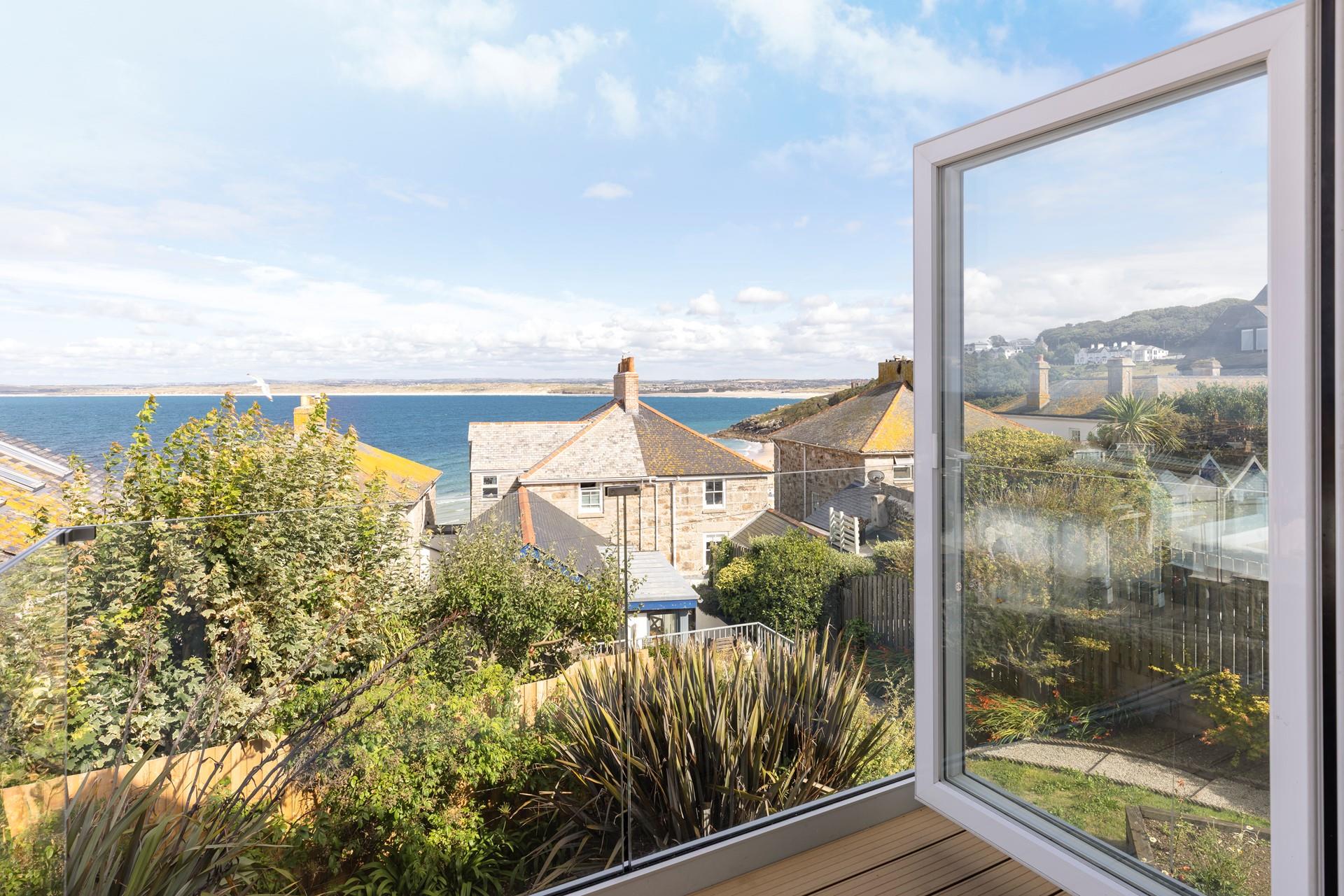 Open the doors on the balcony and gaze out at the views.