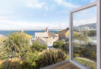 Open the doors on the balcony and gaze out at the views.