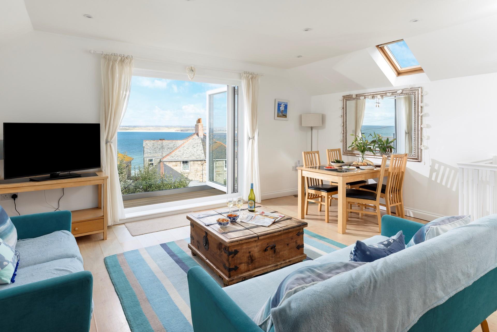 The open plan sitting and dining area is a space for the whole family to dine and relax.