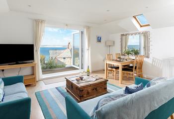 The open plan sitting and dining area is a space for the whole family to dine and relax.