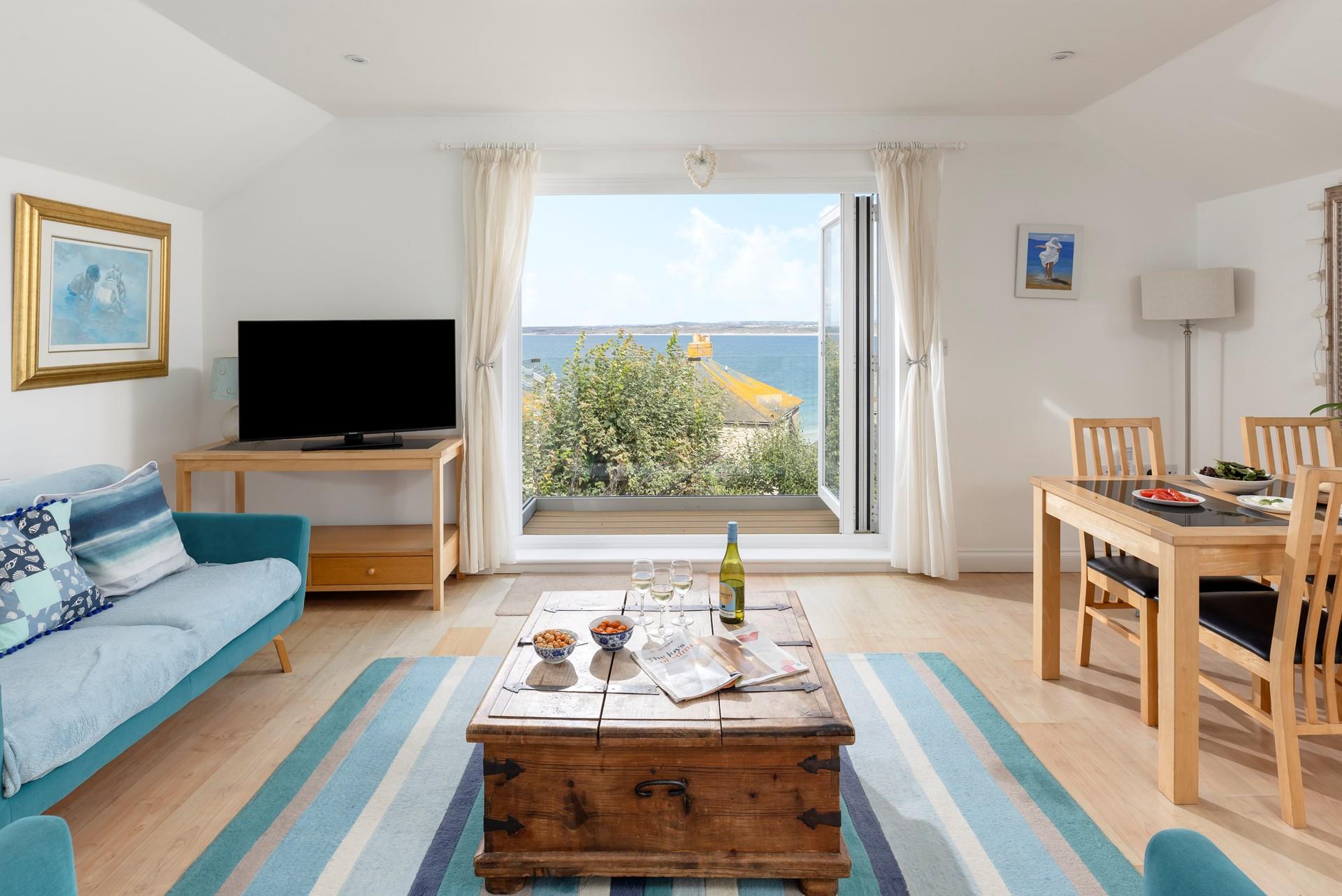 The sitting area is decorated in a lovely cream and blue theme.
