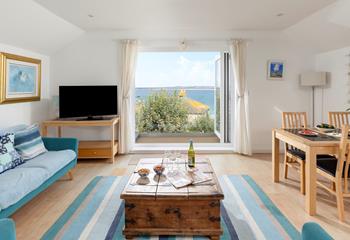 The sitting area is decorated in a lovely cream and blue theme.