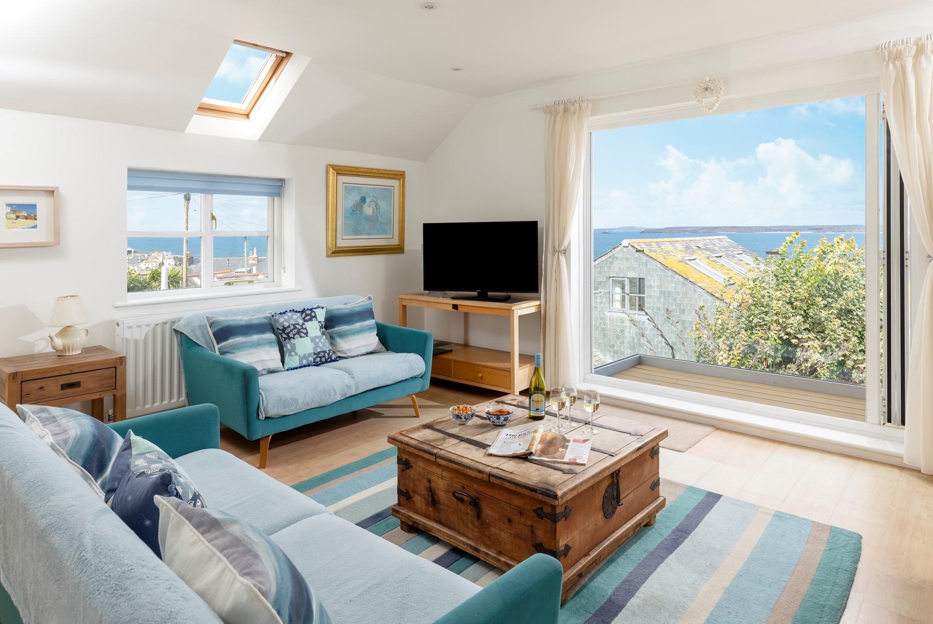 The seating area is equipped with Smart TV and DVD player, perfect for movie nights.