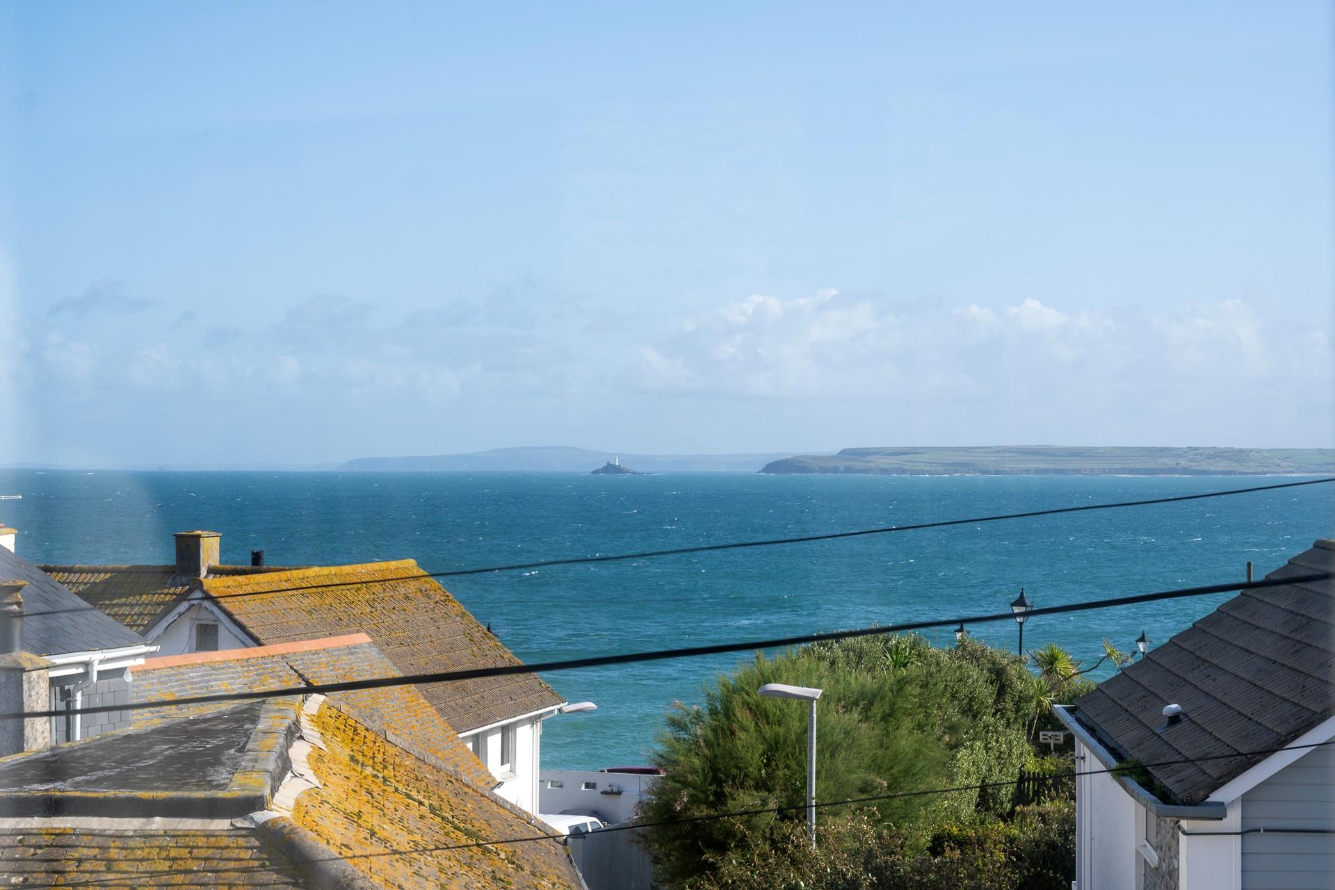 Gaze out over the iconic St Ives rooftops to the sea sparkling in the distance.