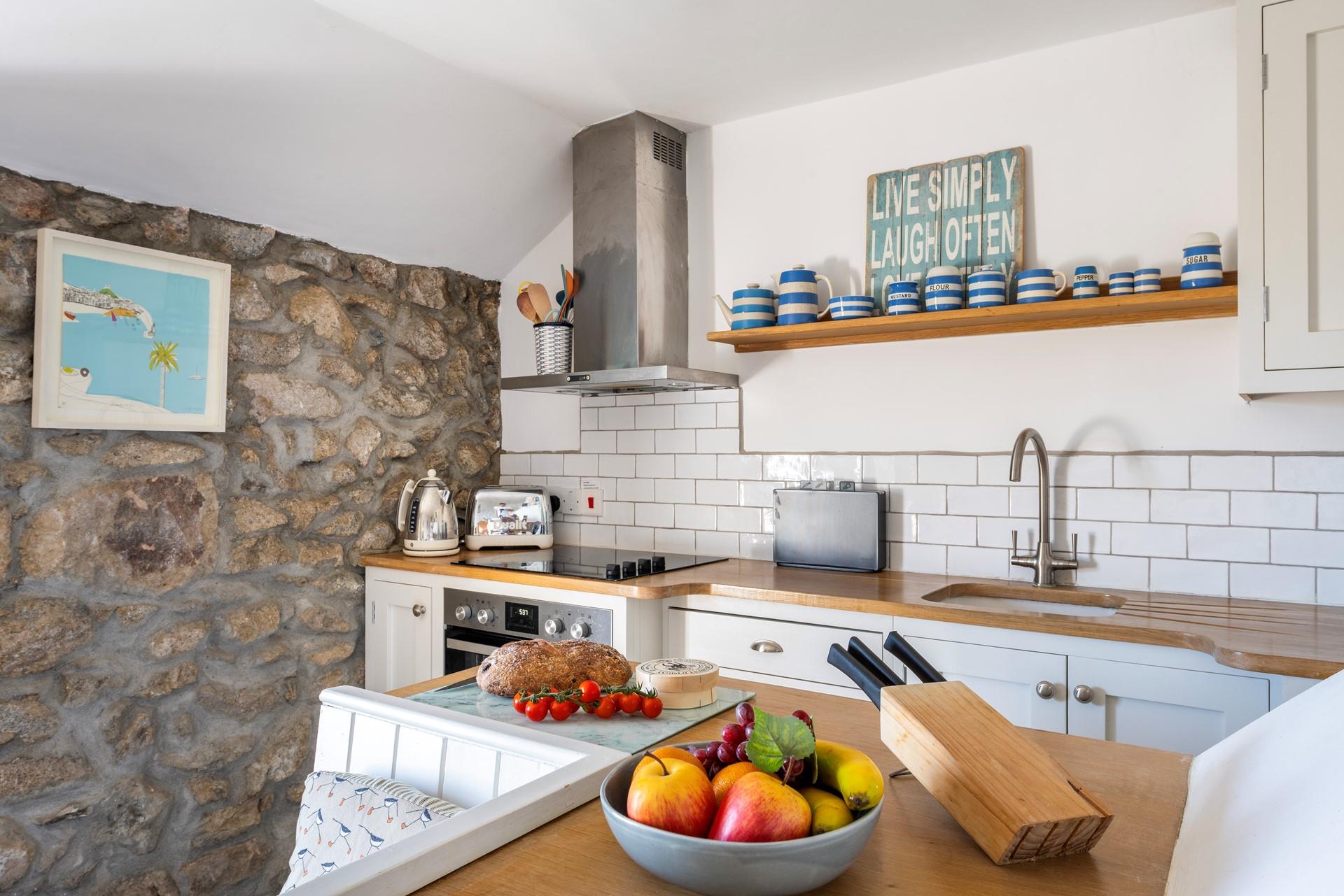 Though compact, the kitchen is fabulously well-equipped.