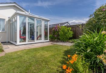 The private garden at the rear is accessed via the conservatory.