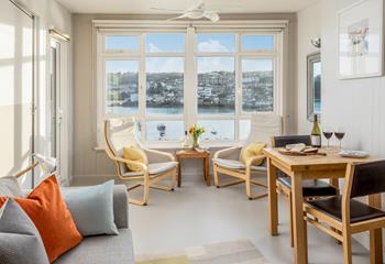 The sitting room boasts fantastic harbour views through the beautiful windows. 