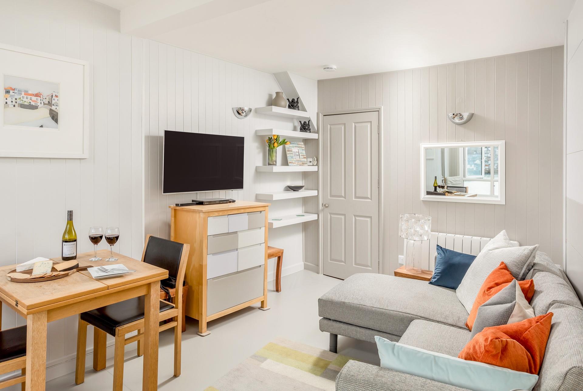 Cosy and comfortable, the sitting room is a calming place to relax and unwind. 