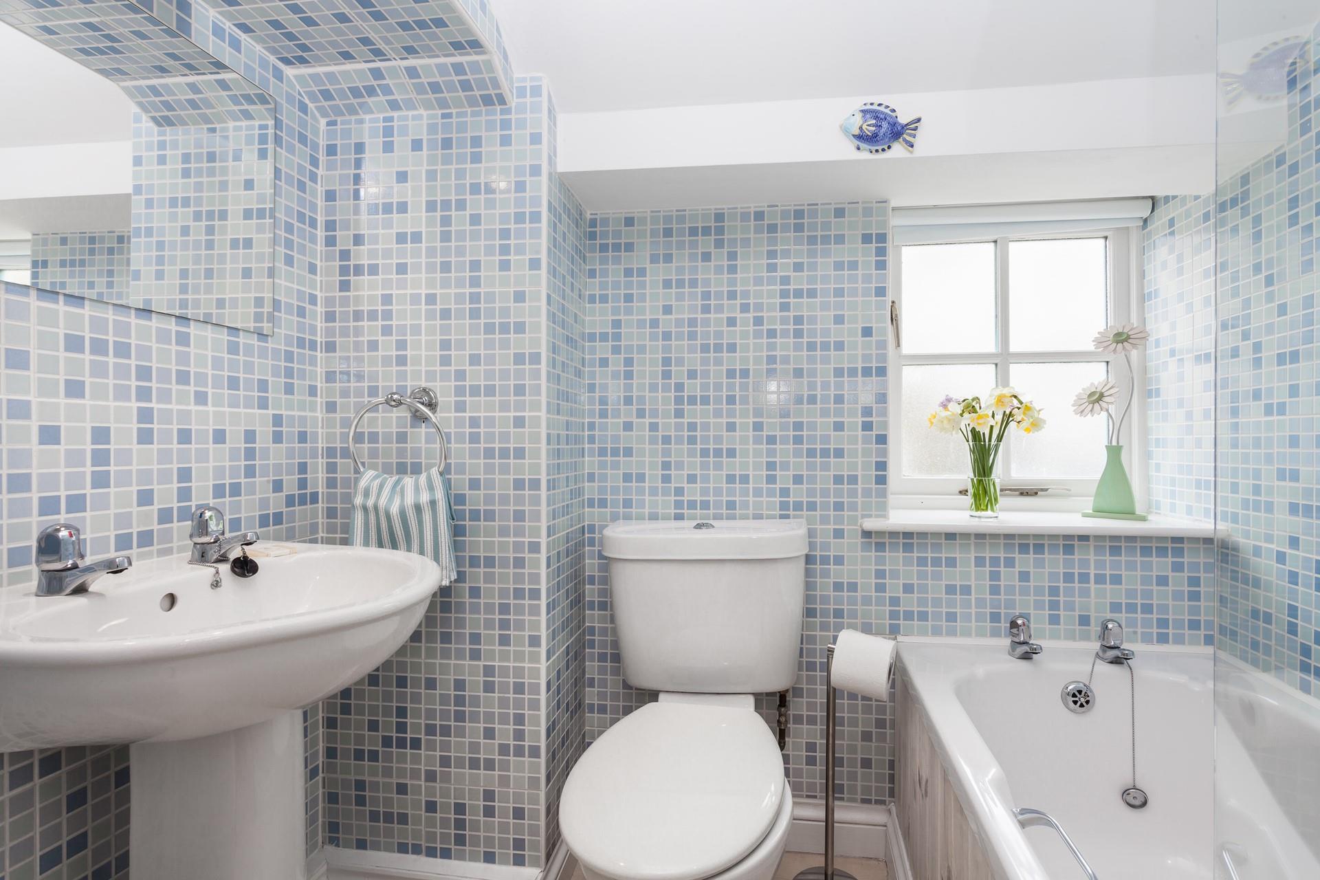 Bedroom 1 benefits from an en suite with bath and shower. Perfect for offering extra space to get ready.