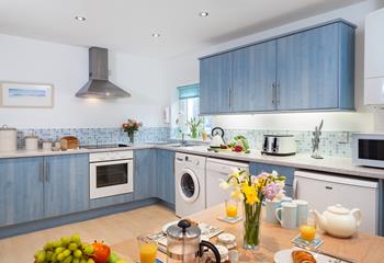 The unique kitchen has a stunning blue theme, reminding you just how close to the sea you are.