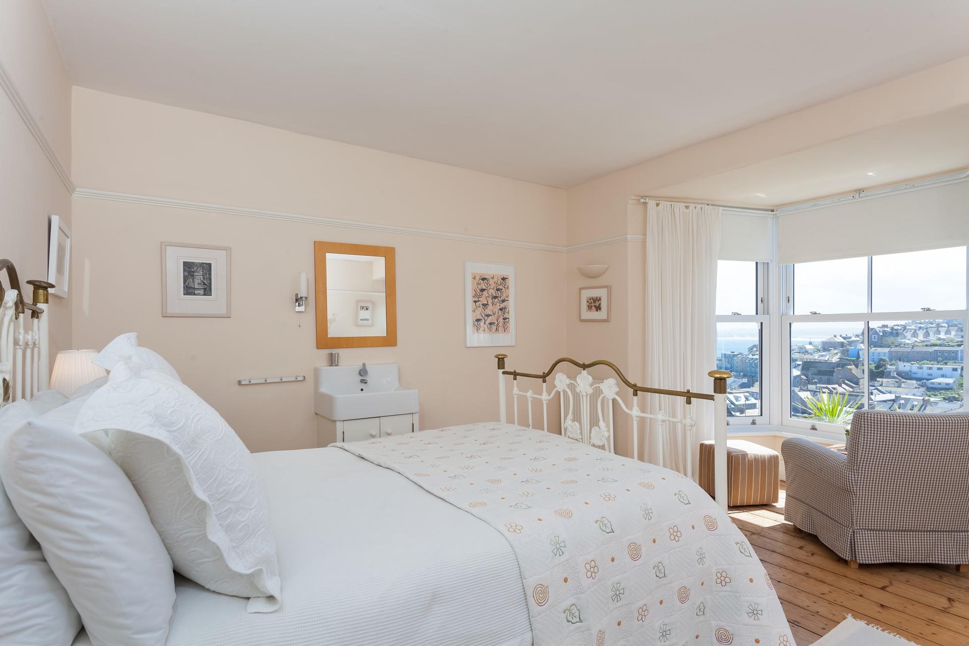 Enjoy relaxing in bed with a cup of tea admiring the sea views over towards Hayle from Bedroom 1.