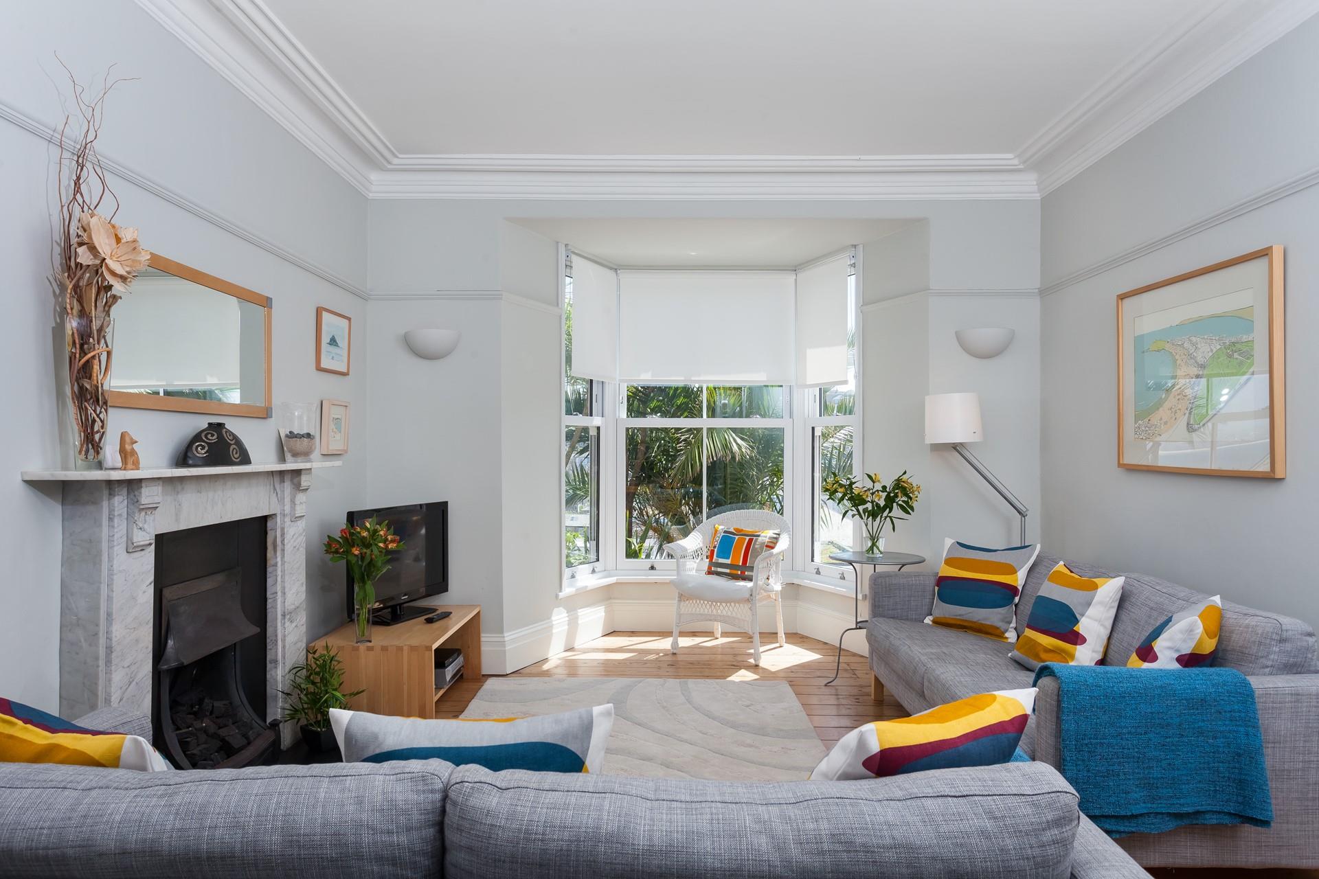 Relax in this modern living room with the gas fire warming you up in colder months - bliss!