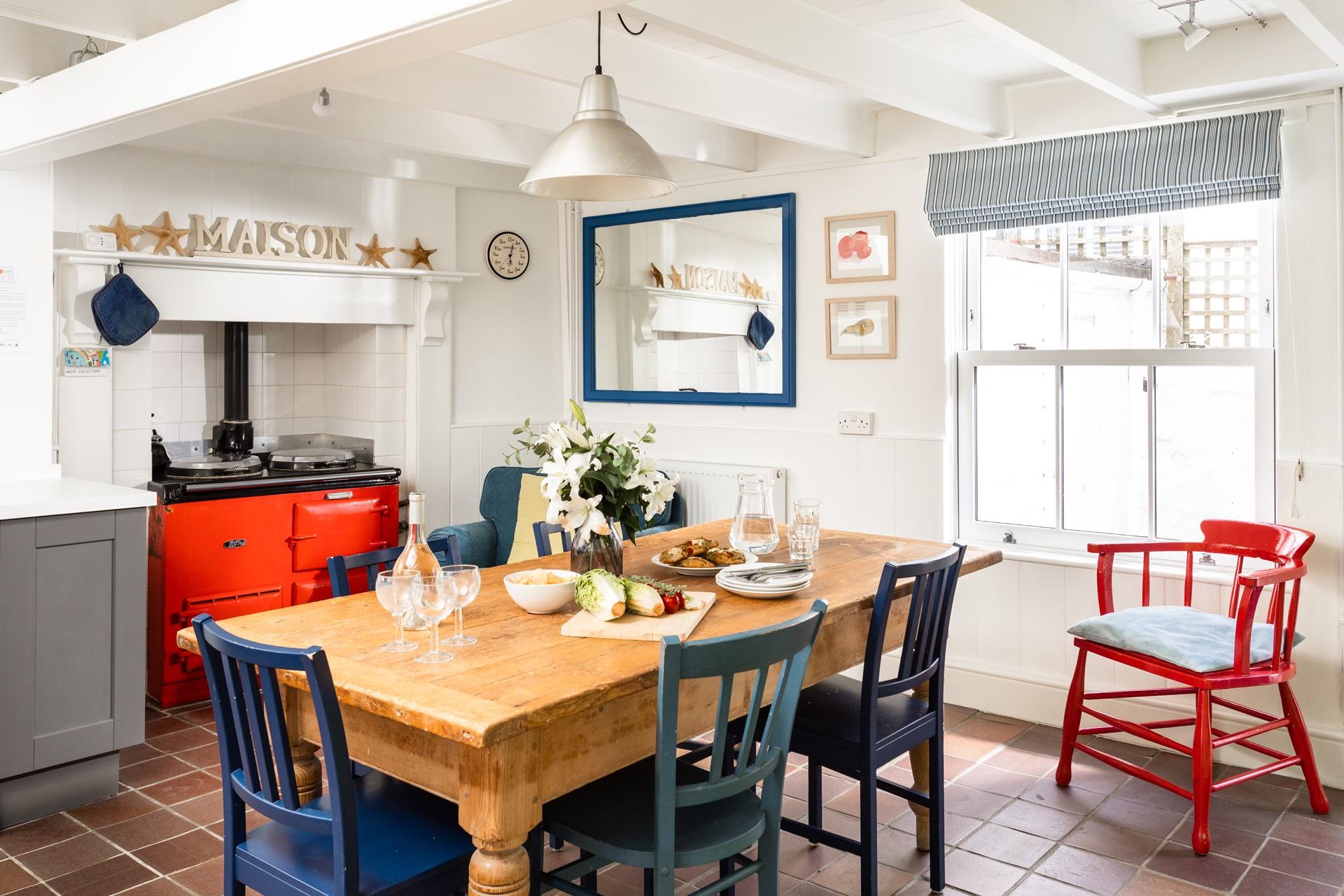 The large wooden dining table is perfect for family dinners.