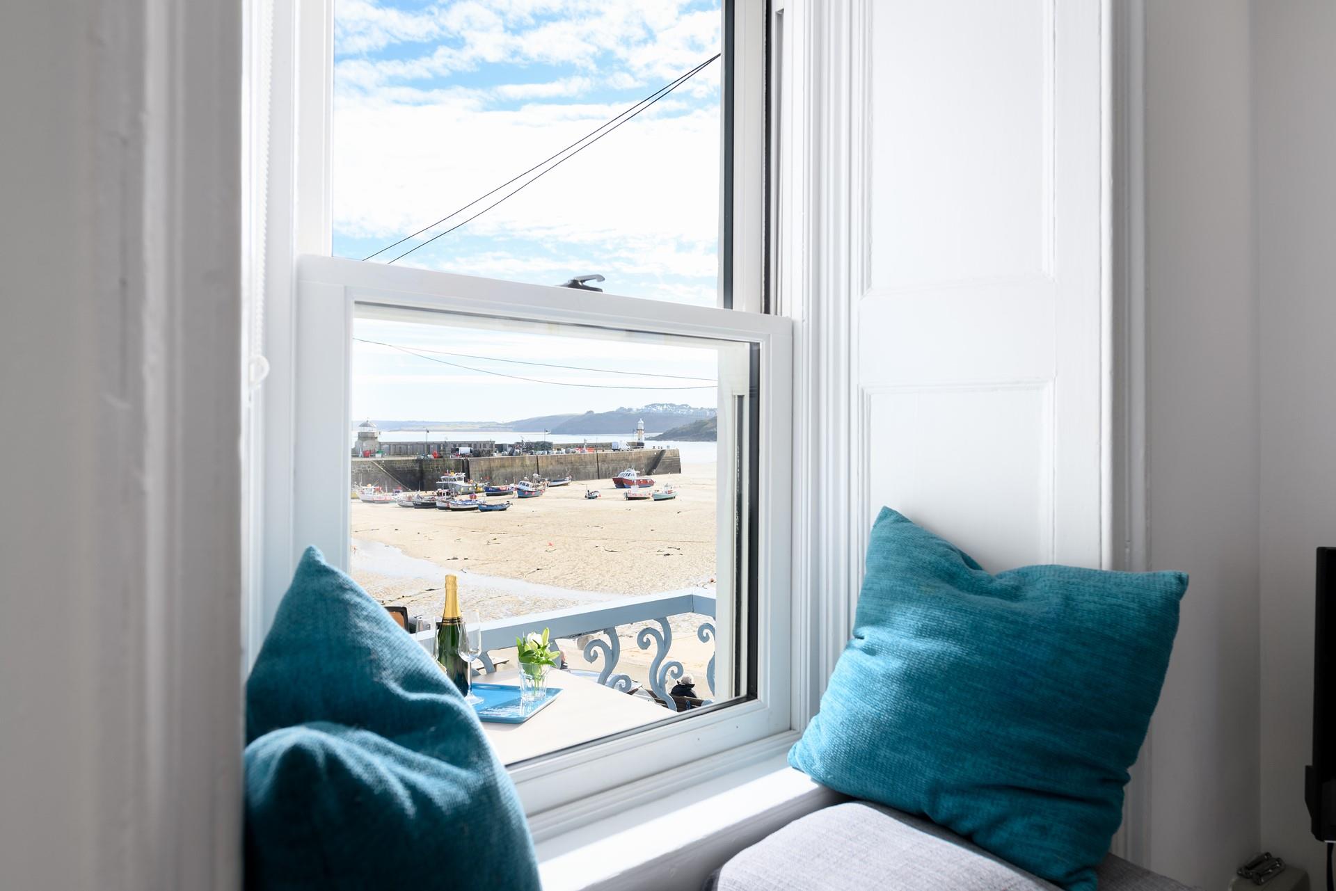 Tuck yourself away in the window seat and get lost in a good book or just enjoy the views with a drink in hand.