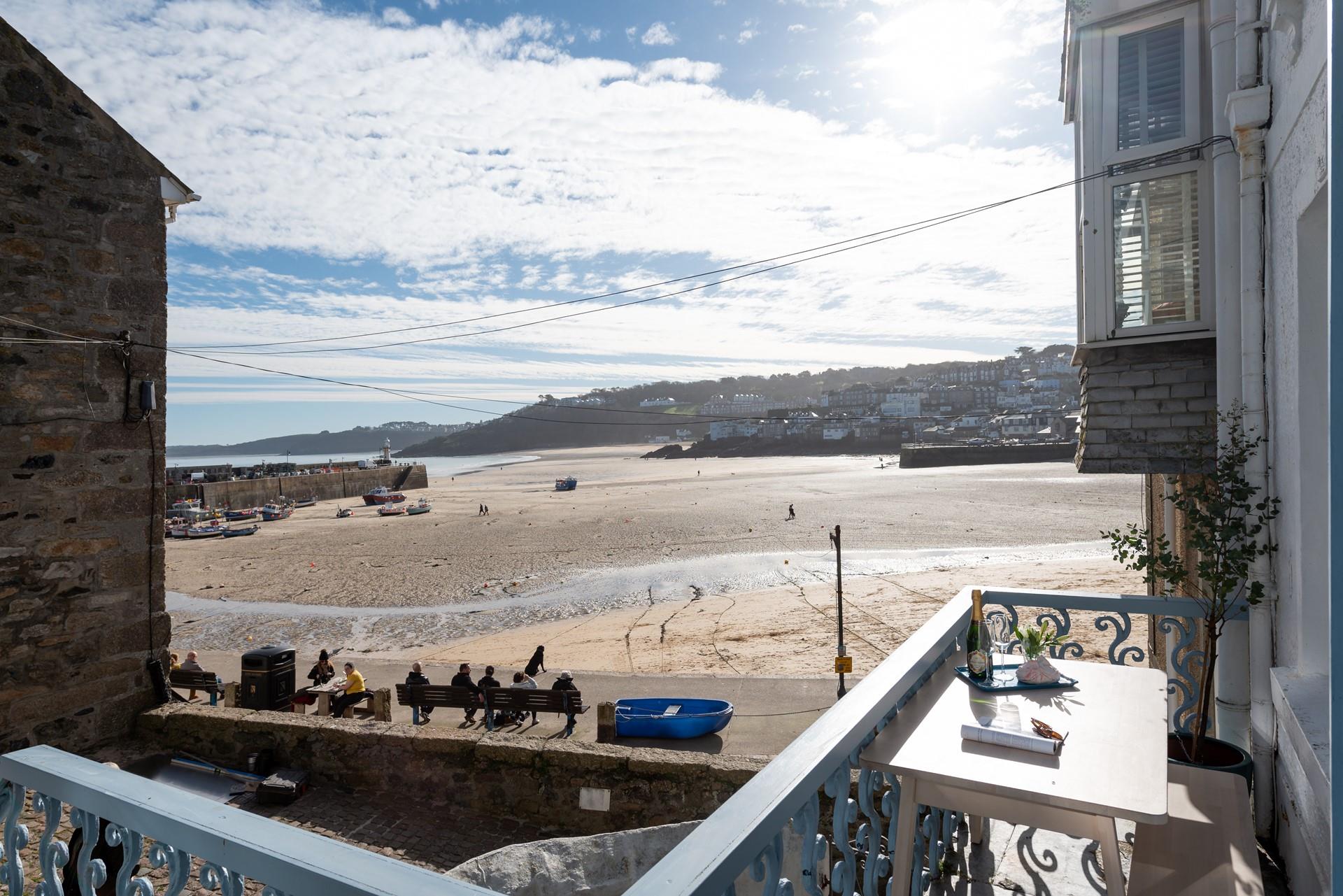 Watch the sun come down on the front balcony with a glass of something cold.