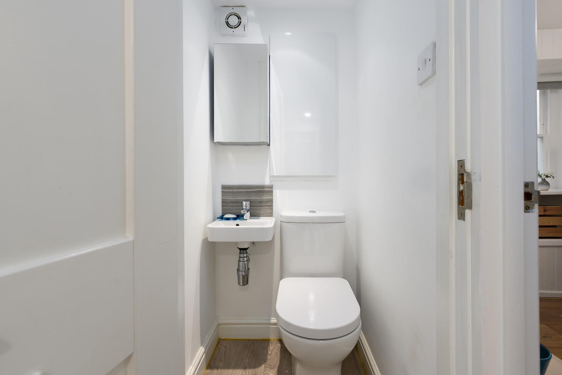 A handy cloakroom offers additional space to freshen up.