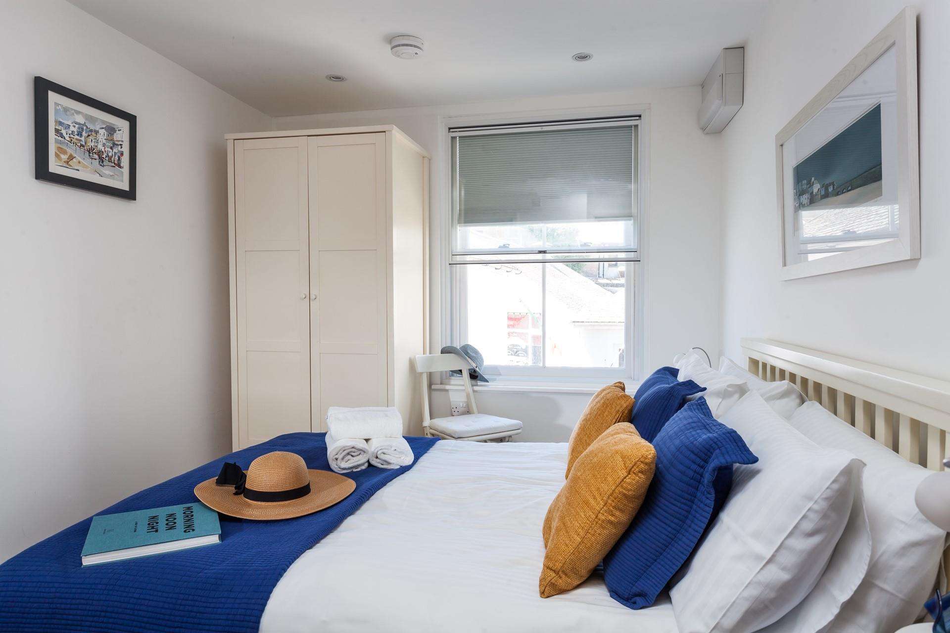 We love the calming colour palette in the bedroom.