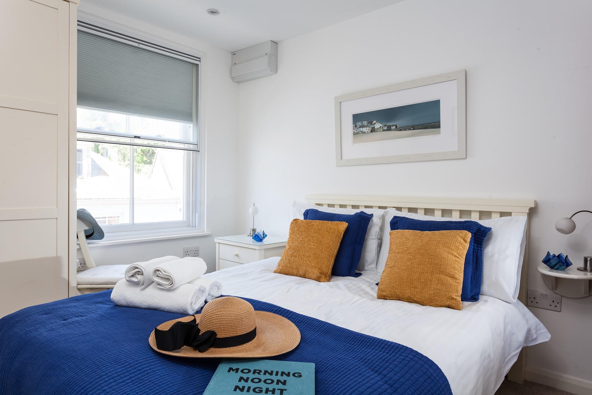 A comfortable double bed promises a blissful night's sleep.