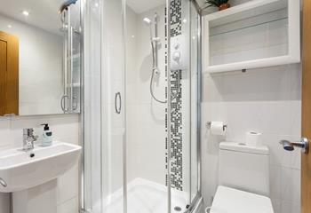 Light and bright, the en suite shower room is perfect for rinsing off the sand after a day exploring the coast.