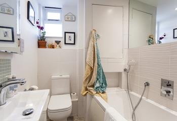 The main bathroom and an additional shower room offer guests plenty of space to get ready for the day ahead. 