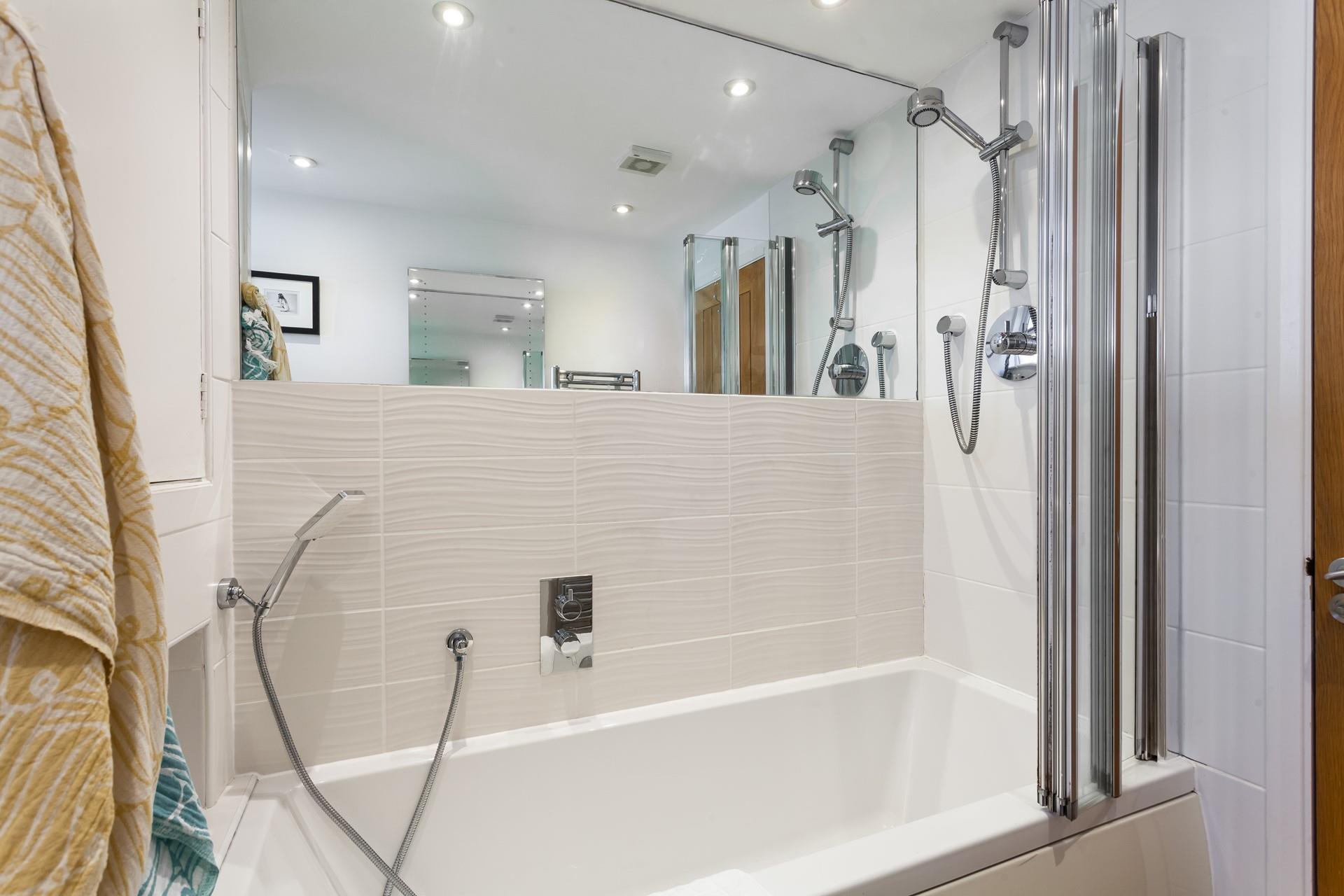 The main bathroom is perfect for pampering yourself with a bubbly soak.