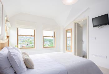 Bedroom 1 has an en suite and views towards to sea.