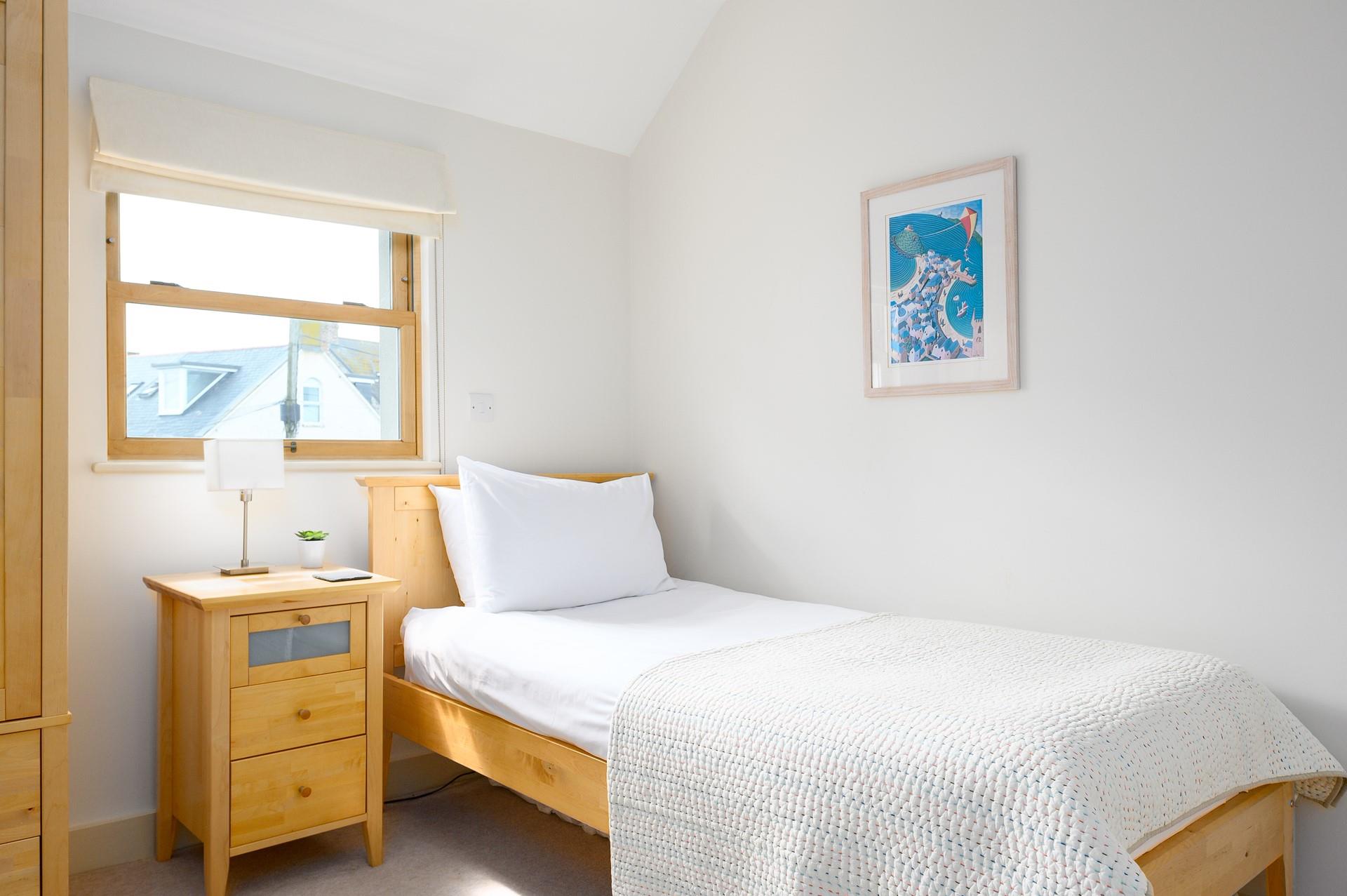 Cosy into bed after spending the evening at a harbourfront restaurant.