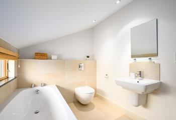 The family bathroom has a bath to relax after a day walking the coast path.