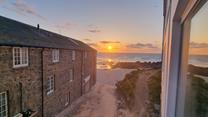 Watch the sunset over Porthmeor Beach to top off a memorable day.