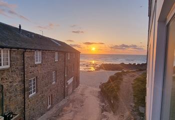 Watch the sunset over Porthmeor Beach to top off a memorable day.