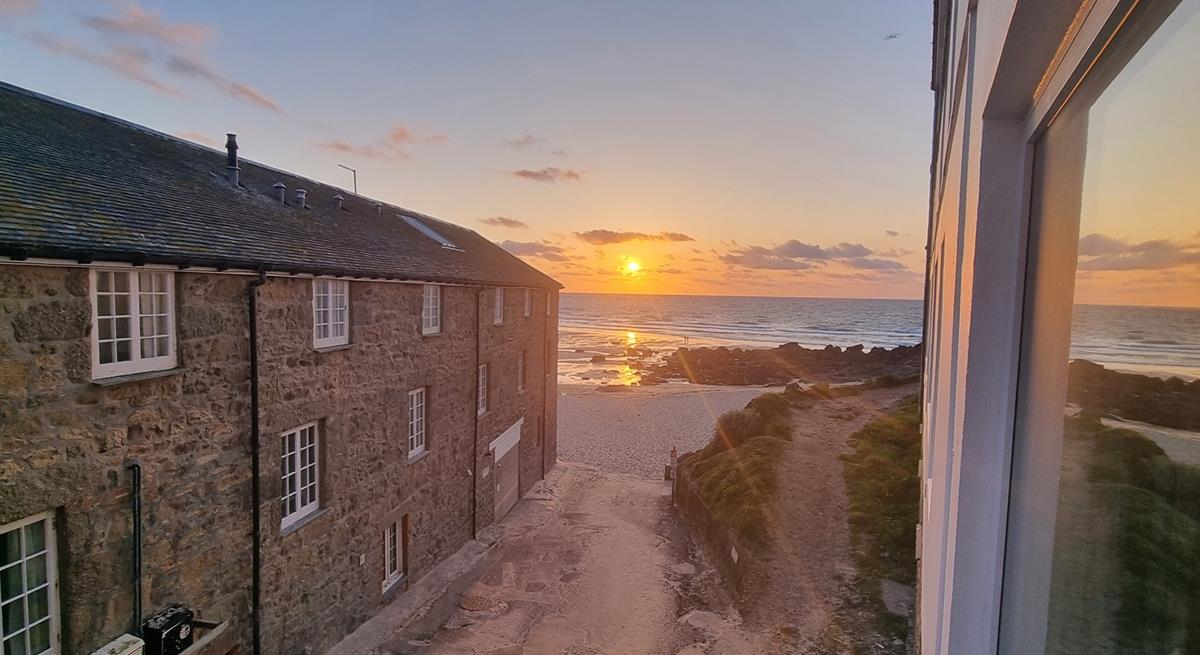 Watch the sunset over Porthmeor Beach to top off a memorable day.